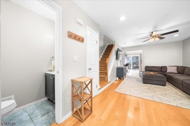 424 Willow Ct, Raritan Twp, NJ 08822 - living area featuring stairway, ceiling fan, recessed lighting, light wood-style floors, and baseboards