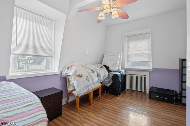 548 Jefferson Ave, Elizabeth City, NJ 07201 - bedroom featuring radiator, wood finished floors, and a ceiling fan