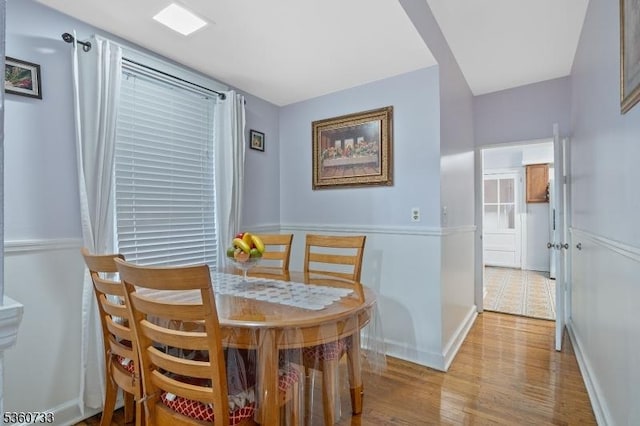 548 Jefferson Ave, Elizabeth City, NJ 07201 - dining room featuring wood finished floors, baseboards, and arched walkways