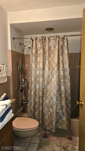 255 Tucker Ave Unit 239, Union Twp, NJ 07083 - bathroom with shower / bath combo, vanity, tile patterned floors, a textured ceiling, and toilet