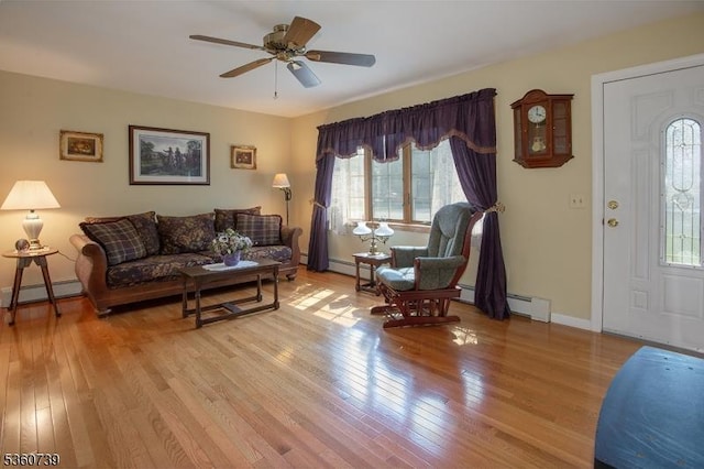 455 Rte 206, Andover Twp, NJ 07860 - living area with light wood-style flooring, a baseboard radiator, ceiling fan, baseboards, and a baseboard heating unit