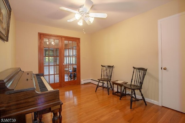 455 Rte 206, Andover Twp, NJ 07860 - living area featuring light wood finished floors, ceiling fan, baseboards, and a baseboard heating unit