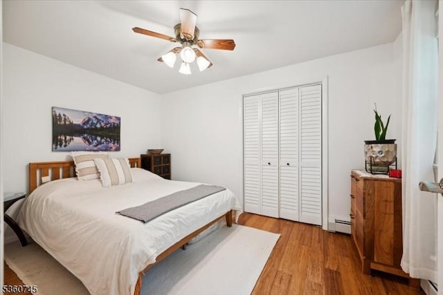 42 Wildwood Ter, Watchung Boro, NJ 07069 - bedroom with light wood finished floors, a closet, baseboard heating, and a ceiling fan