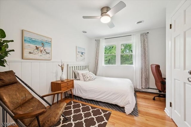 42 Wildwood Ter, Watchung Boro, NJ 07069 - bedroom featuring wood finished floors, a wainscoted wall, and ceiling fan