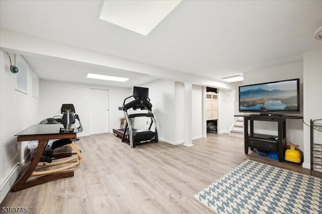 42 Wildwood Ter, Watchung Boro, NJ 07069 - exercise room with a baseboard heating unit and wood finished floors