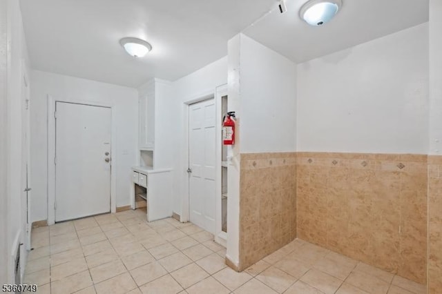 30-32 Geneva St, Elizabeth City, NJ 07206 - corridor with light tile patterned floors