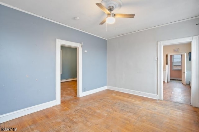 30-32 Geneva St, Elizabeth City, NJ 07206 - empty room featuring ceiling fan, baseboards, light wood-style floors, a smoke detector, and ornamental molding