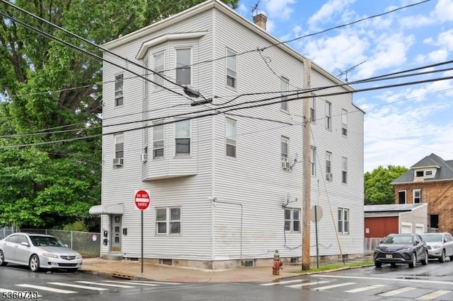 30-32 Geneva St, Elizabeth City, NJ 07206 - view of side of property with a chimney