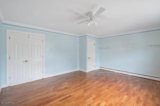 30-32 Geneva St, Elizabeth City, NJ 07206 - empty room with baseboard heating, ceiling fan, ornamental molding, wood finished floors, and baseboards