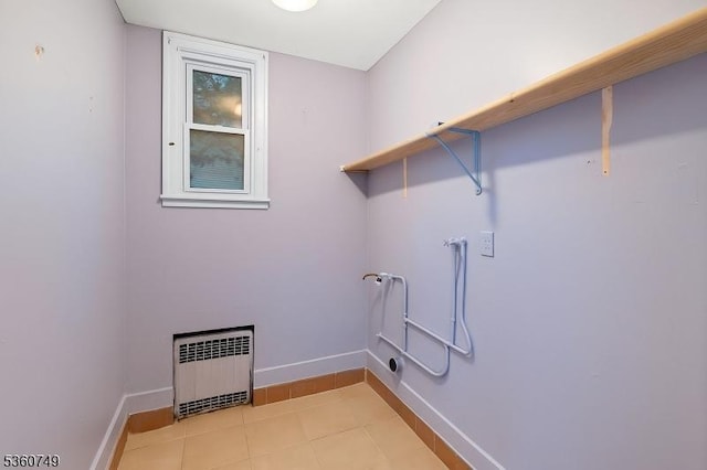 30-32 Geneva St, Elizabeth City, NJ 07206 - laundry area featuring radiator, washer hookup, baseboards, and light tile patterned floors