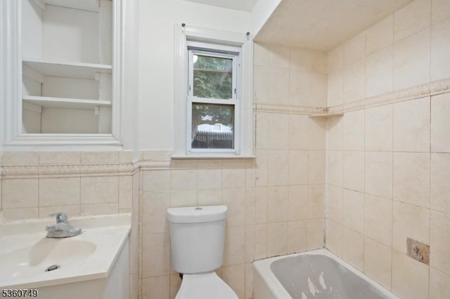 30-32 Geneva St, Elizabeth City, NJ 07206 - full bathroom with vanity, toilet, and tile walls