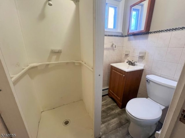 118 Maple St, Kearny Town, NJ 07032 - bathroom featuring vanity, toilet, a baseboard radiator, a shower, and tile walls