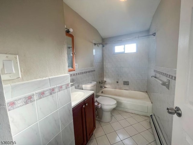 118 Maple St, Kearny Town, NJ 07032 - bathroom featuring baseboard heating, tile walls, tile patterned floors, vanity, and shower / bathtub combination