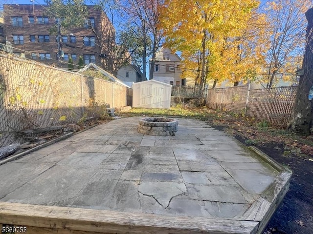 118 Maple St, Kearny Town, NJ 07032 - fenced backyard with an outdoor fire pit and a patio area