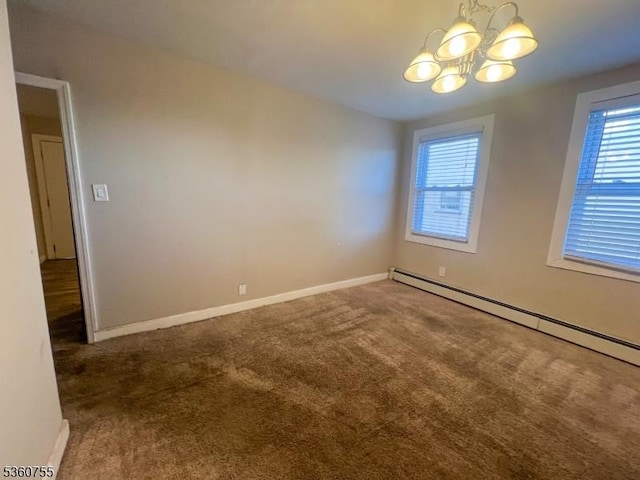 118 Maple St, Kearny Town, NJ 07032 - carpeted empty room featuring a baseboard radiator, a chandelier, plenty of natural light, and baseboards