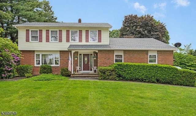 94 Hoagland Rd, Blairstown Twp, NJ 07825 - view of front of house with a chimney, a front lawn, and brick siding