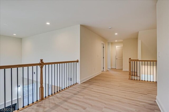 92 Hancock Rd, Piscataway Twp, NJ 08854 - corridor with light wood-style floors, recessed lighting, baseboards, and an upstairs landing