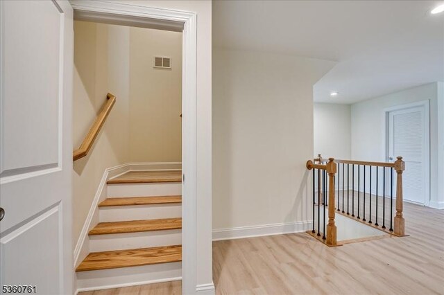 92 Hancock Rd, Piscataway Twp, NJ 08854 - stairway featuring wood finished floors, recessed lighting, and baseboards