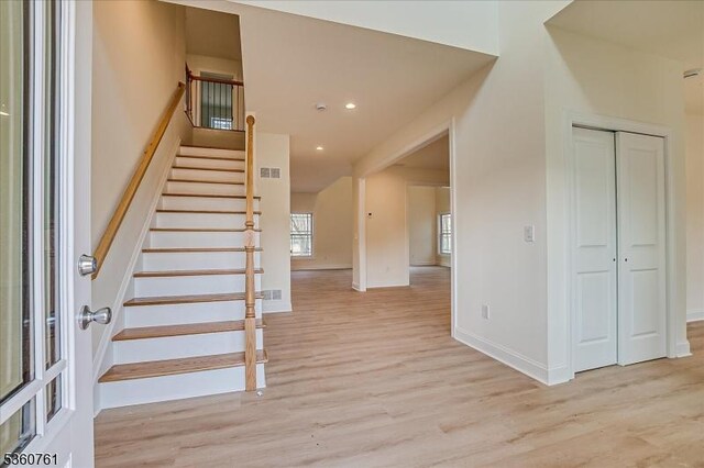 92 Hancock Rd, Piscataway Twp, NJ 08854 - stairway with wood finished floors, baseboards, and recessed lighting