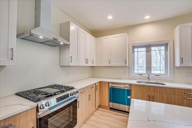 92 Hancock Rd, Piscataway Twp, NJ 08854 - kitchen with wall chimney exhaust hood, dishwasher, stainless steel range with gas cooktop, a sink, and light stone counters