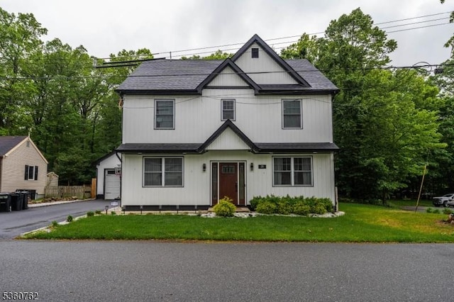 29 Tennis Rd, Jefferson Twp, NJ 07849 - view of front of home with asphalt driveway, a front yard, and a garage