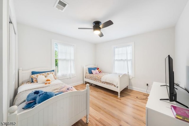 29 Tennis Rd, Jefferson Twp, NJ 07849 - bedroom featuring multiple windows, light wood-style flooring, and baseboards