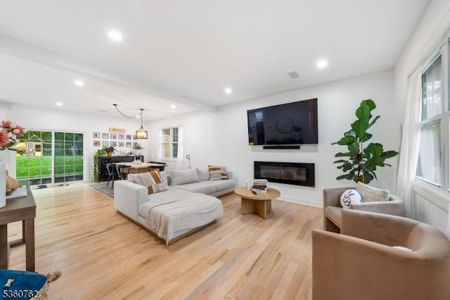 29 Tennis Rd, Jefferson Twp, NJ 07849 - living area featuring light wood-style flooring, recessed lighting, healthy amount of natural light, and a glass covered fireplace