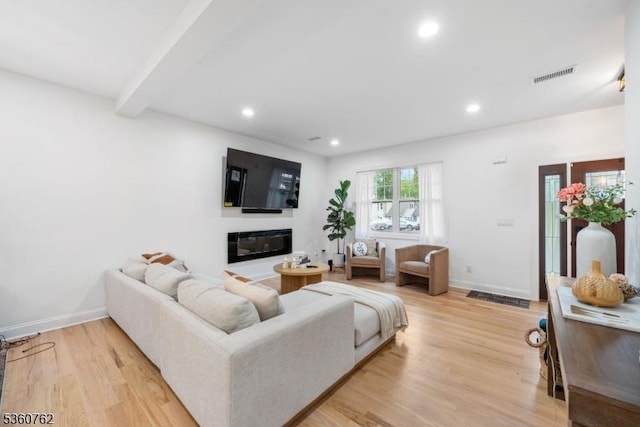 29 Tennis Rd, Jefferson Twp, NJ 07849 - living area with recessed lighting, light wood finished floors, baseboards, beam ceiling, and a glass covered fireplace