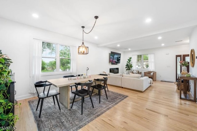29 Tennis Rd, Jefferson Twp, NJ 07849 - dining room with light wood finished floors, recessed lighting, baseboards, and a glass covered fireplace