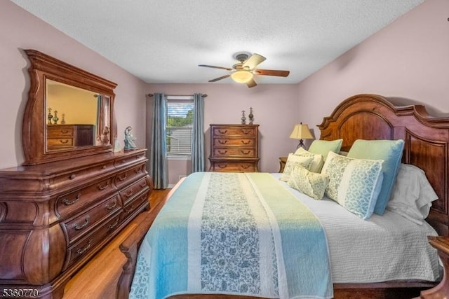 17 4th St, South River Boro, NJ 08882 - bedroom with wood finished floors, a textured ceiling, and ceiling fan