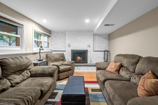 17 4th St, South River Boro, NJ 08882 - living room with a brick fireplace, wood finished floors, and recessed lighting