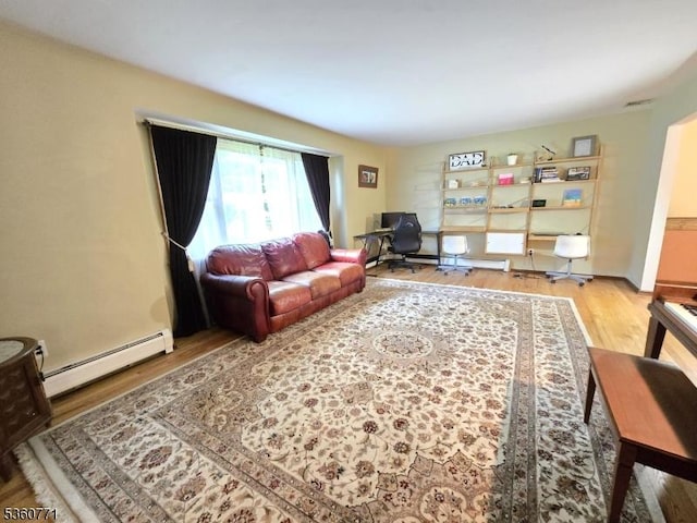 14 Constitution Ave, Roxbury Twp, NJ 07876 - living area with a baseboard radiator, wood finished floors, and a desk