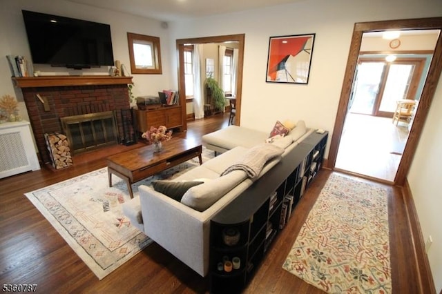 137 Oak Ridge Ave, Nutley Twp, NJ 07110 - living area with wood finished floors, plenty of natural light, and a brick fireplace
