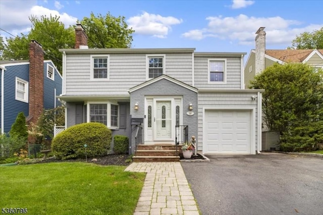 30 Newman Ave, Verona Twp, NJ 07044 - view of front of home with a front lawn, asphalt driveway, a garage, and a chimney