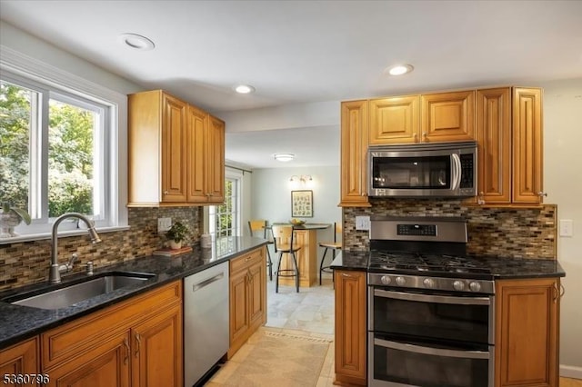 30 Newman Ave, Verona Twp, NJ 07044 - kitchen featuring stainless steel appliances, a sink, dark stone counters, backsplash, and recessed lighting