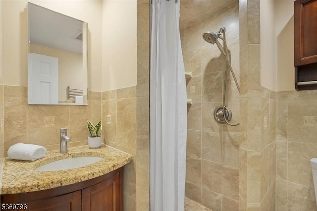 30 Newman Ave, Verona Twp, NJ 07044 - bathroom with a stall shower, vanity, and tile walls