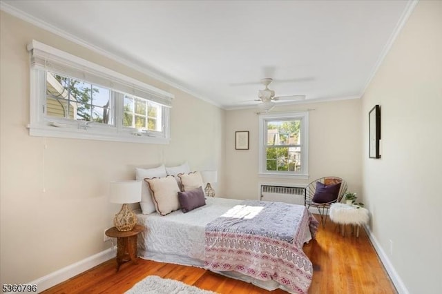 30 Newman Ave, Verona Twp, NJ 07044 - bedroom featuring radiator heating unit, wood finished floors, crown molding, baseboards, and a ceiling fan
