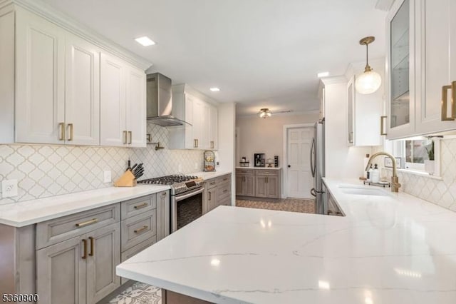 31 Woodside Ave, Cranford Twp, NJ 07016 - kitchen with wall chimney range hood, appliances with stainless steel finishes, tasteful backsplash, glass insert cabinets, and recessed lighting