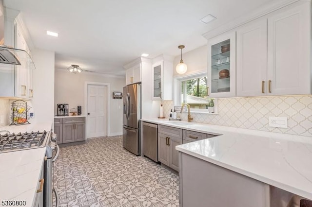 31 Woodside Ave, Cranford Twp, NJ 07016 - kitchen with stainless steel appliances, wall chimney exhaust hood, decorative backsplash, light stone counters, and pendant lighting