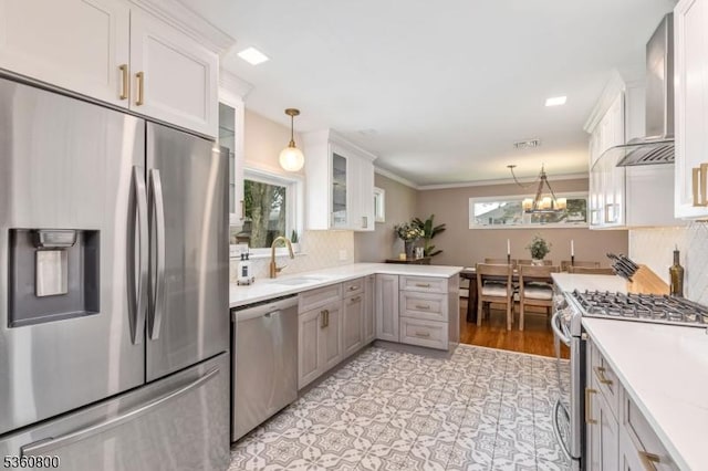 31 Woodside Ave, Cranford Twp, NJ 07016 - kitchen with stainless steel appliances, wall chimney exhaust hood, light countertops, glass insert cabinets, and decorative backsplash