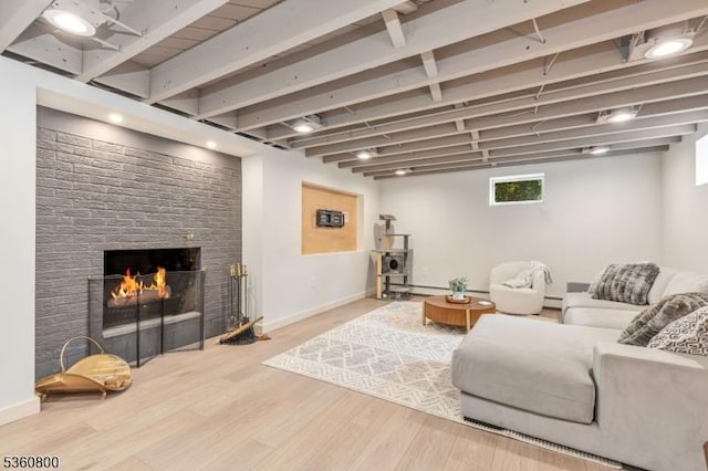 31 Woodside Ave, Cranford Twp, NJ 07016 - living room with wood finished floors, a baseboard radiator, a brick fireplace, and beamed ceiling