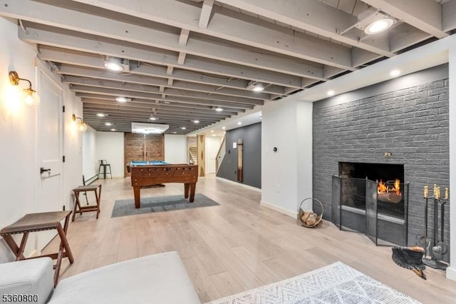 31 Woodside Ave, Cranford Twp, NJ 07016 - rec room with billiards table, light wood finished floors, and a warm lit fireplace