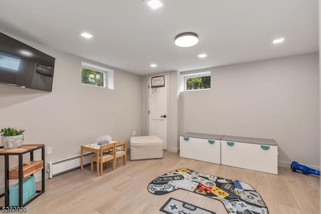 31 Woodside Ave, Cranford Twp, NJ 07016 - playroom with a baseboard heating unit, light wood-type flooring, and recessed lighting