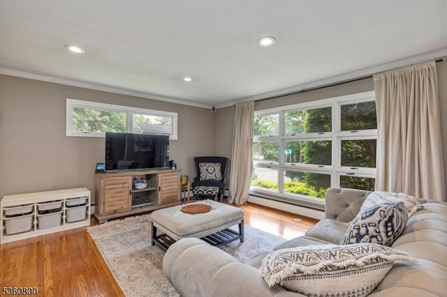 31 Woodside Ave, Cranford Twp, NJ 07016 - living area with baseboard heating, ornamental molding, recessed lighting, healthy amount of natural light, and wood finished floors