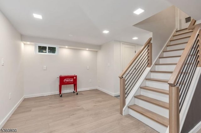 31 Woodside Ave, Cranford Twp, NJ 07016 - finished below grade area with light wood-type flooring, stairs, and recessed lighting