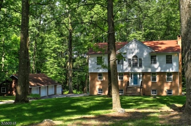 103 Mountain Top Rd, Lebanon Twp, NJ 08826 - view of front of house featuring a garage, an outbuilding, a chimney, a front yard, and entry steps