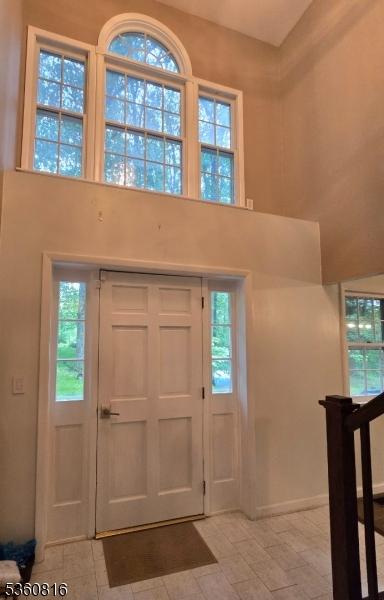 103 Mountain Top Rd, Lebanon Twp, NJ 08826 - foyer with a towering ceiling and baseboards