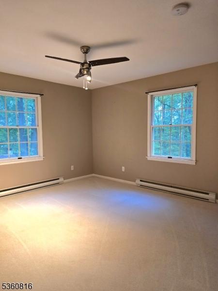 103 Mountain Top Rd, Lebanon Twp, NJ 08826 - spare room with a baseboard radiator, carpet floors, a ceiling fan, and a smoke detector