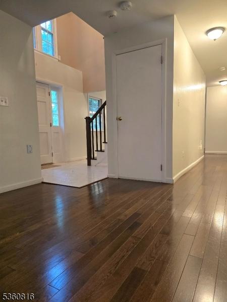 103 Mountain Top Rd, Lebanon Twp, NJ 08826 - foyer entrance featuring dark wood finished floors, stairs, plenty of natural light, baseboards, and a high ceiling