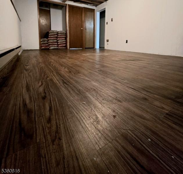103 Mountain Top Rd, Lebanon Twp, NJ 08826 - unfurnished living room with dark wood-type flooring